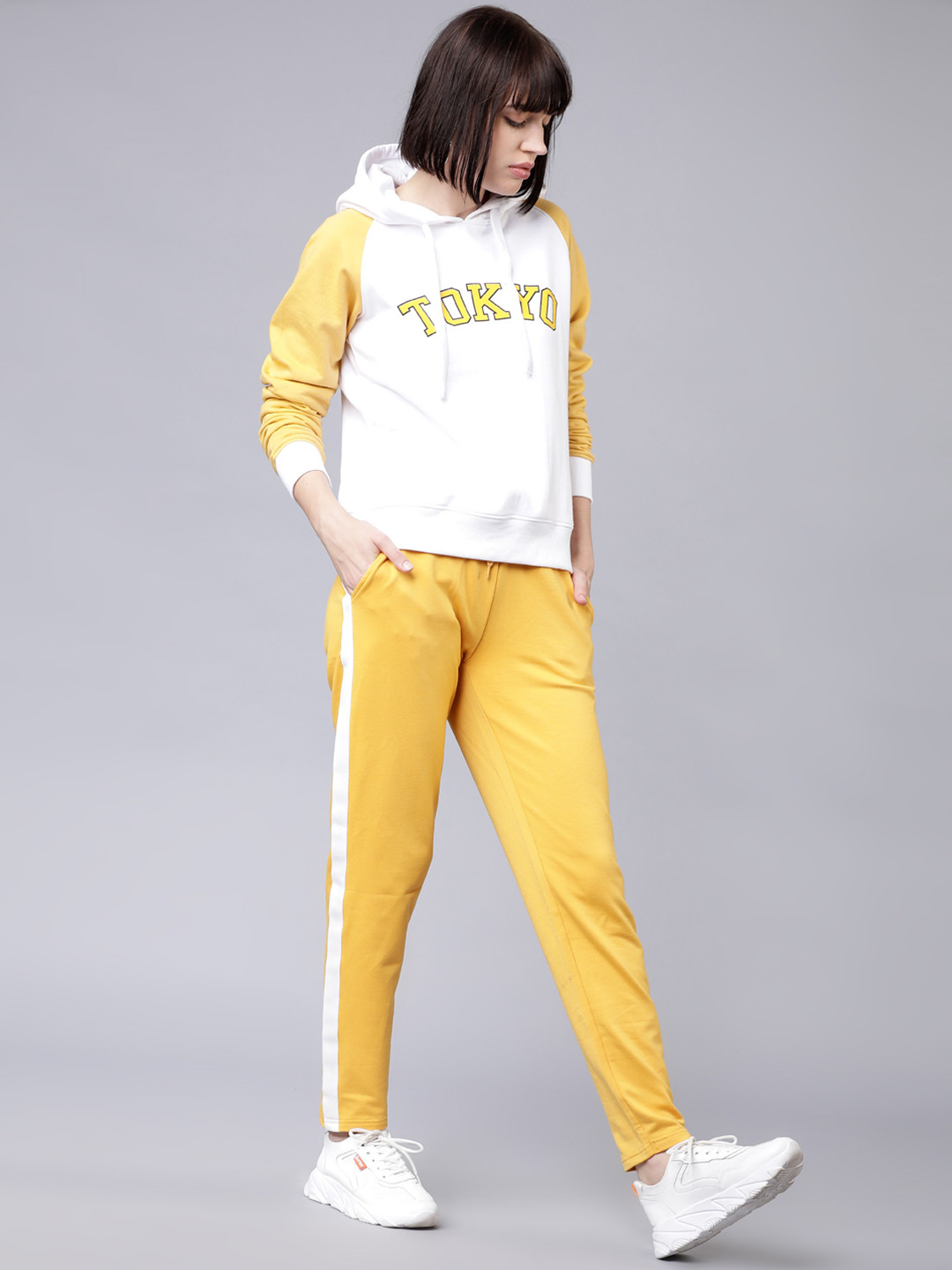 

Tokyo Talkies Women White & Mustard Solid Hooded Sweatshirt