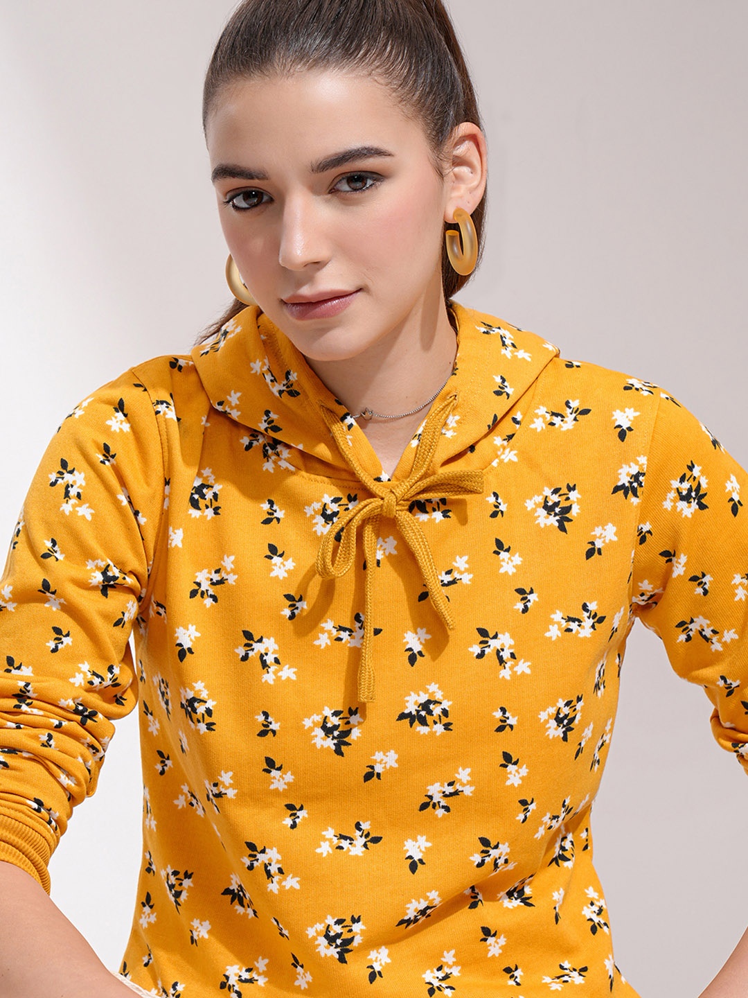 

Tokyo Talkies Women Mustard yellow Printed Hooded Sweatshirt