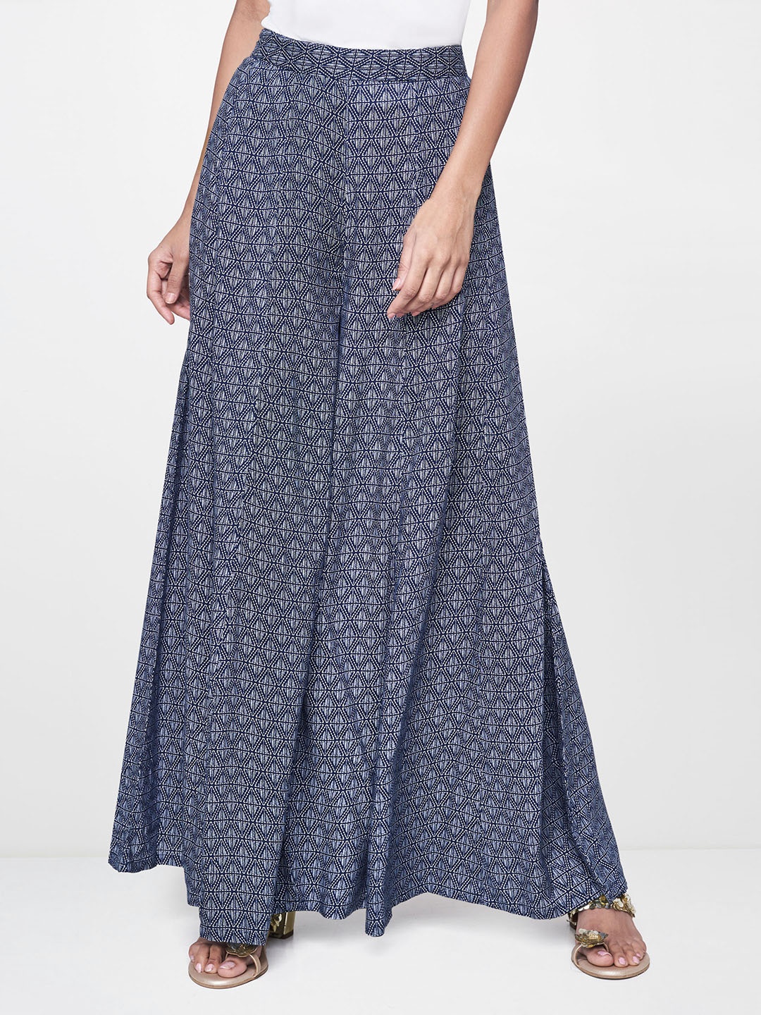 

Global Desi Women Navy Blue & White Regular Fit Printed Flared Trousers