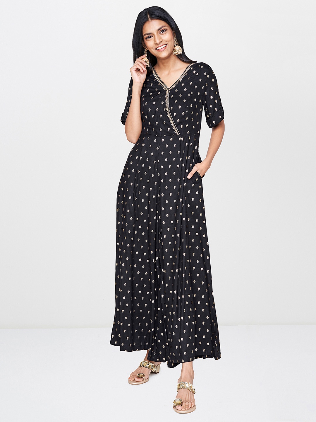 

Global Desi Women Black & Gold-Toned Printed Basic Jumpsuit