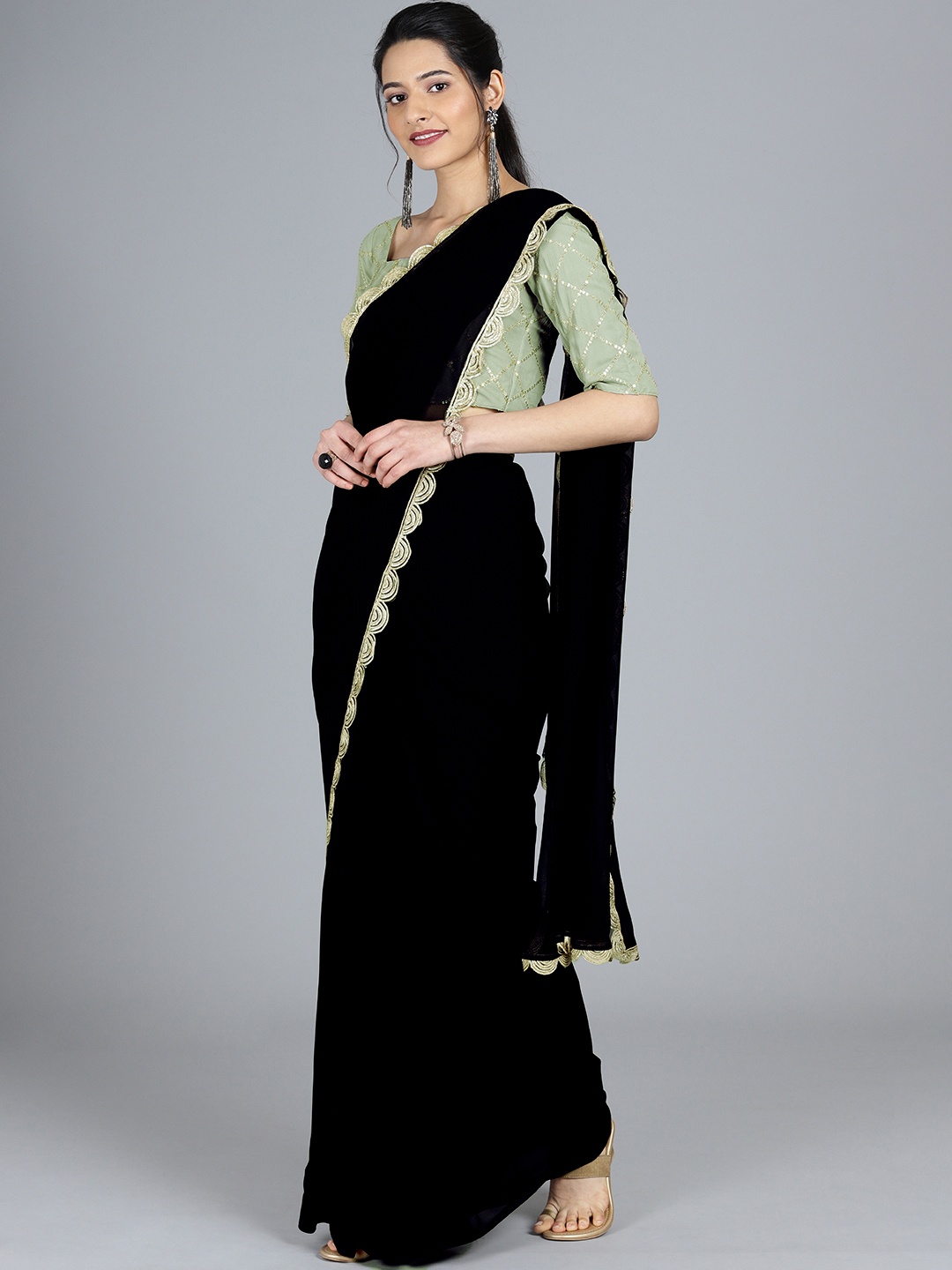 

Ethnovog Black Poly Georgette Solid Saree