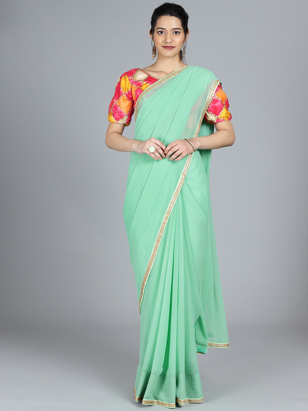 

Ethnovog Green Solid Poly Georgette Saree With Stitched Blouse