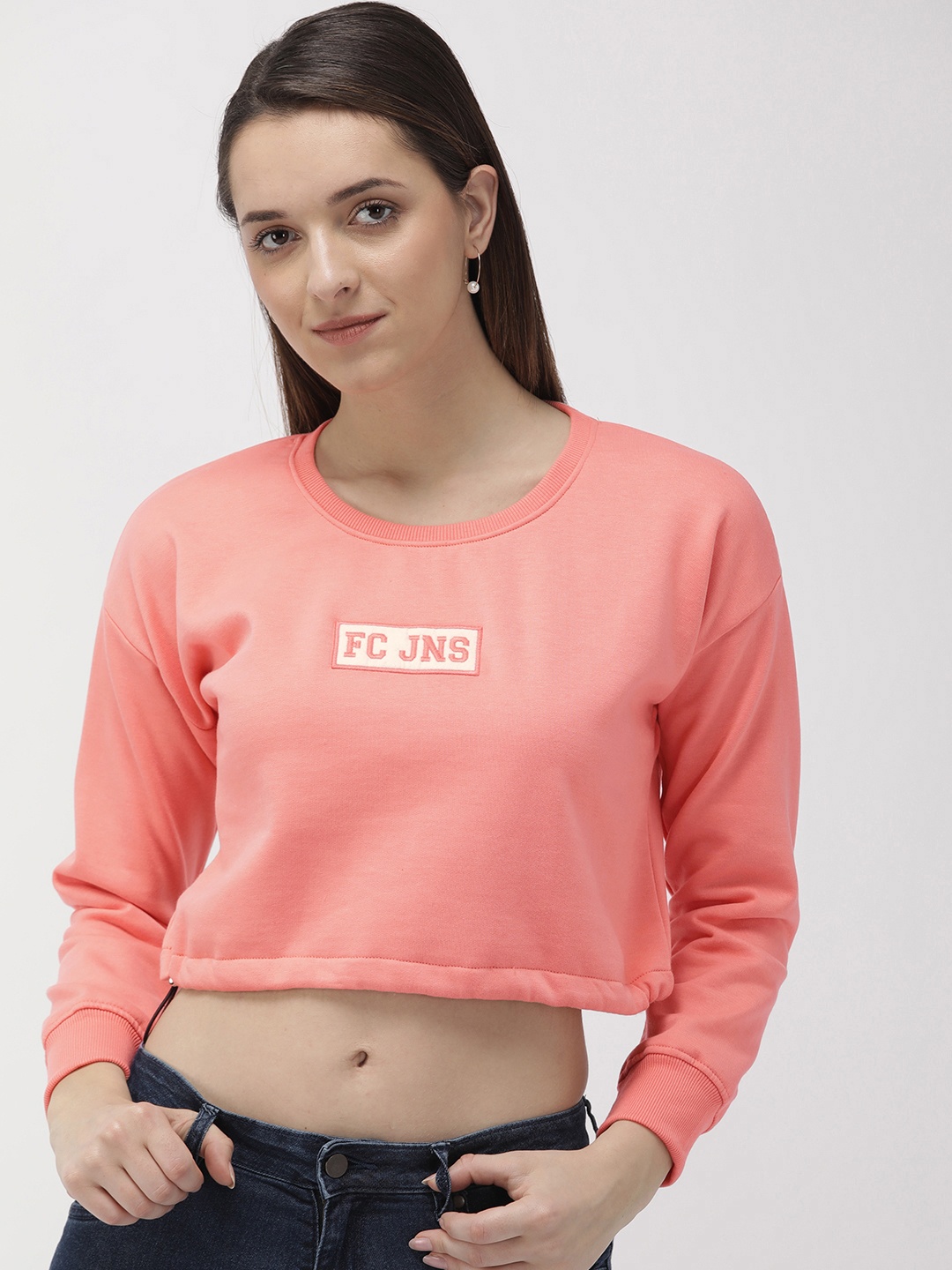 

Fort Collins Women Peach-Coloured Solid Crop Sweatshirt