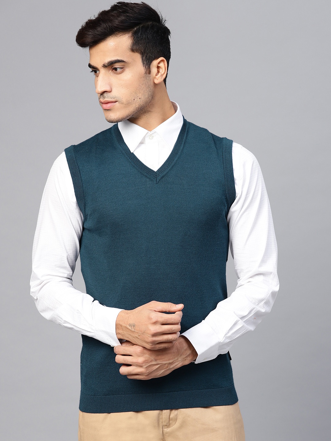 

Van Heusen Men Teal Blue Solid Sweater Vest