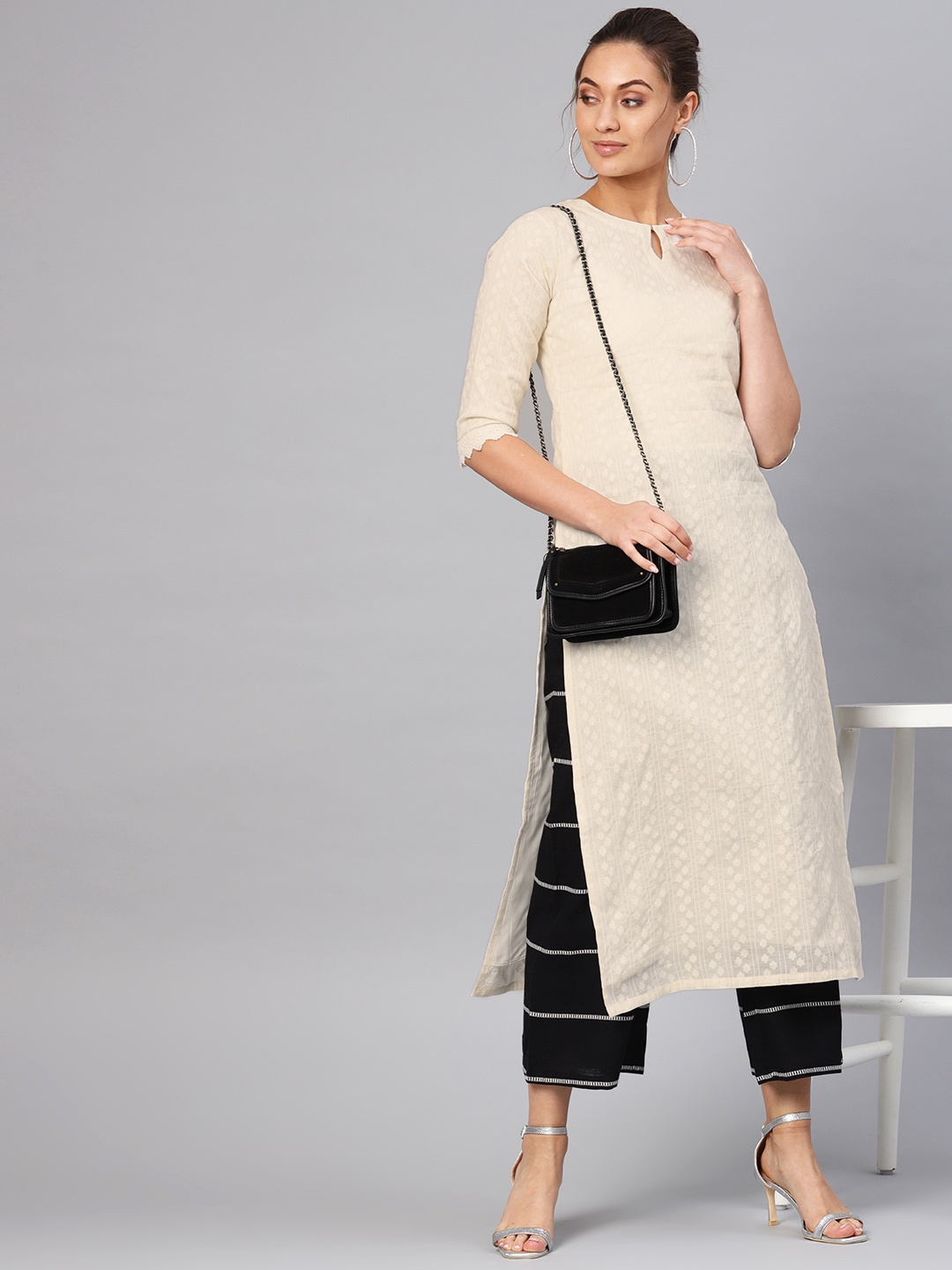 

Libas Women Off-White & Black Self Design Kurta with Palazzos
