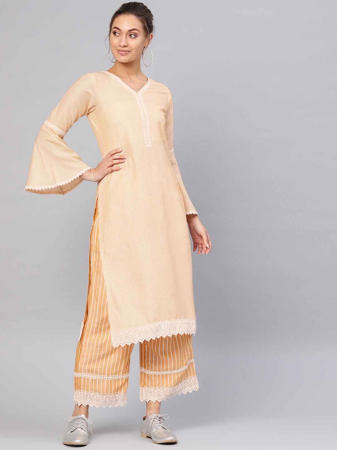 

Libas Women Yellow & White Striped Kurta with Palazzos