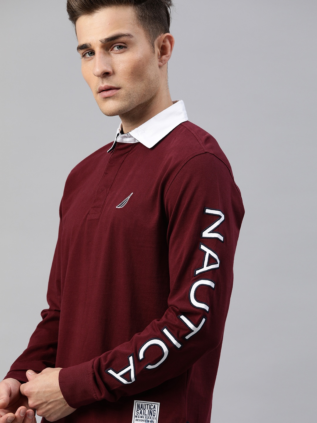 

Nautica Men Burgundy Solid Polo Collar T-shirt With Printed Sleeves