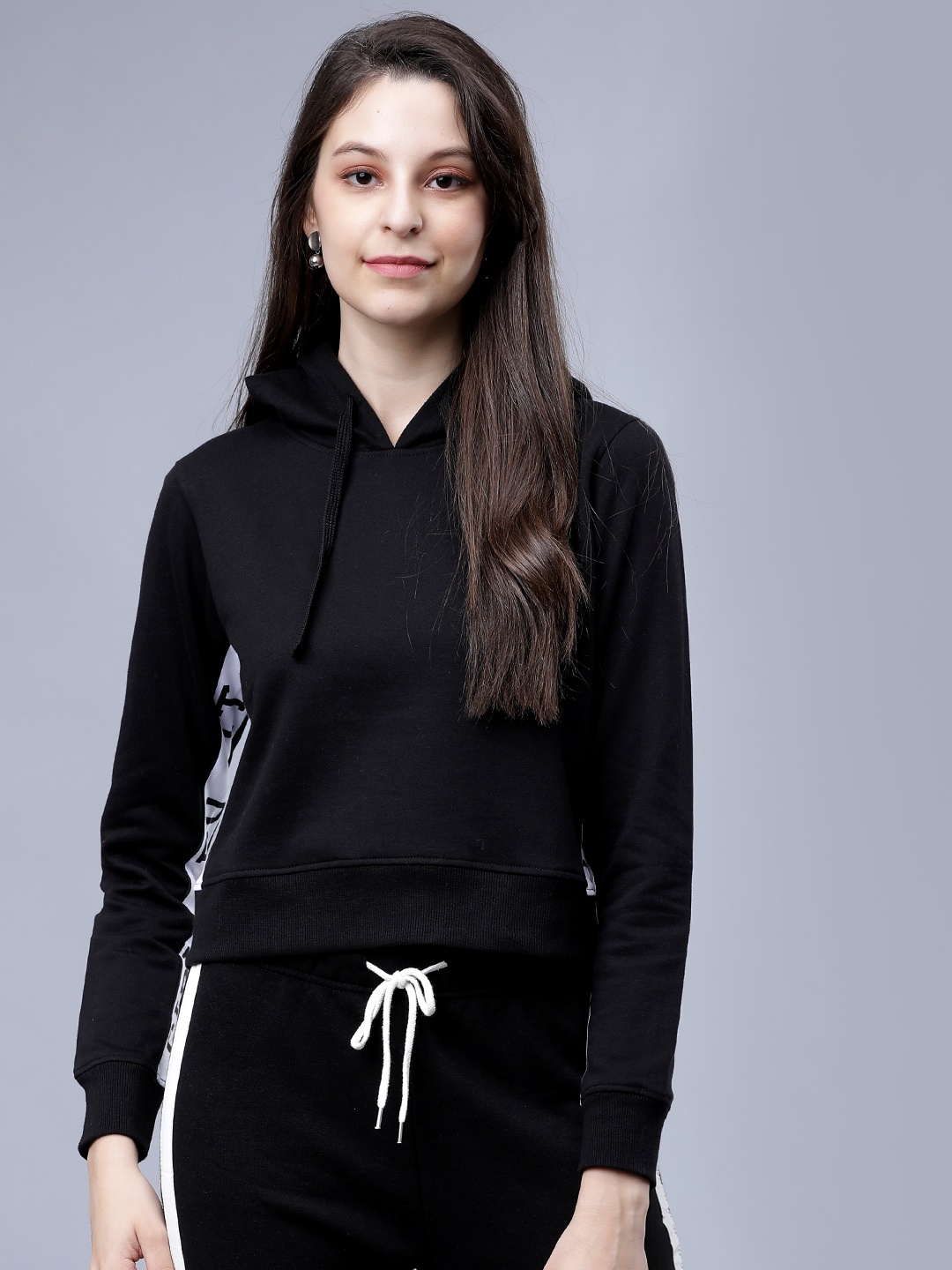 

Tokyo Talkies Women Black & White Solid Hooded Sweatshirt
