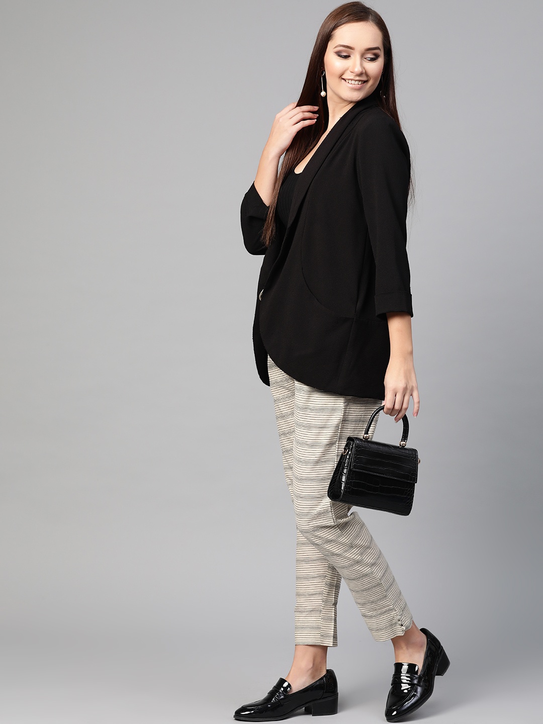 

Ishin Women Off-White & Black Regular Fit Striped Regular Trousers