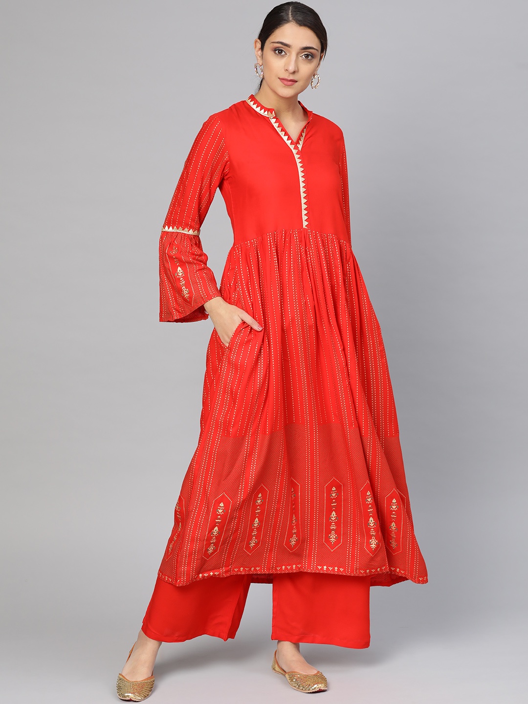 

Tulsattva Women Red & Golden Printed Kurta with Palazzos