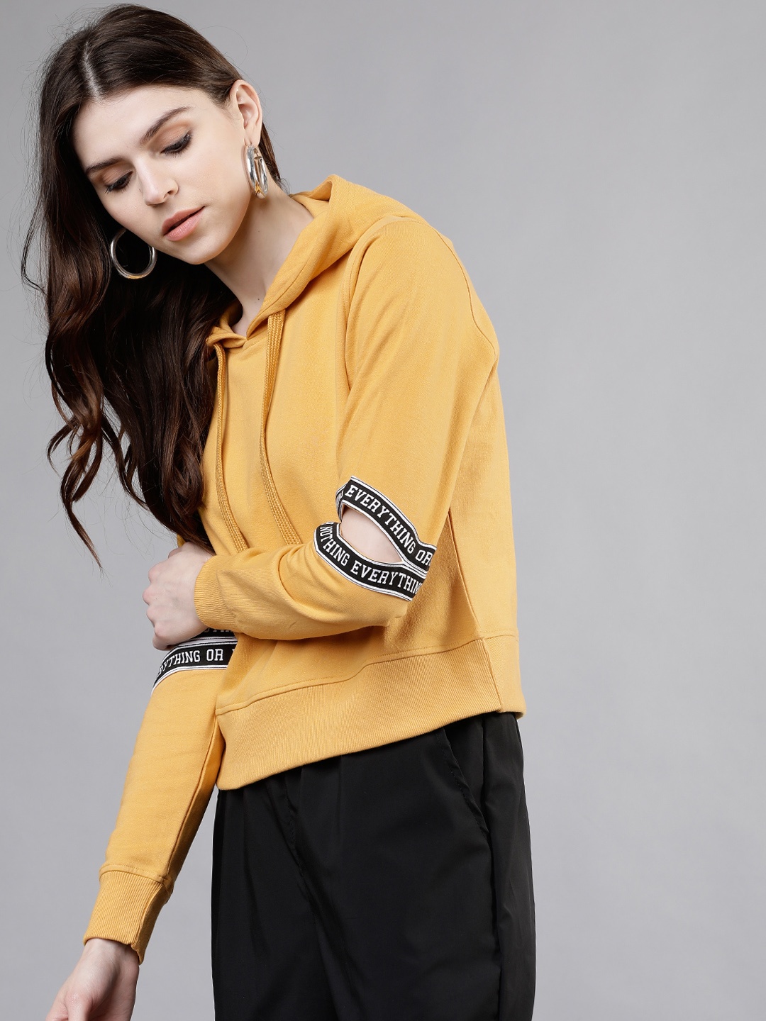 

Tokyo Talkies Women Mustard Yellow Solid Hooded Crop Sweatshirt