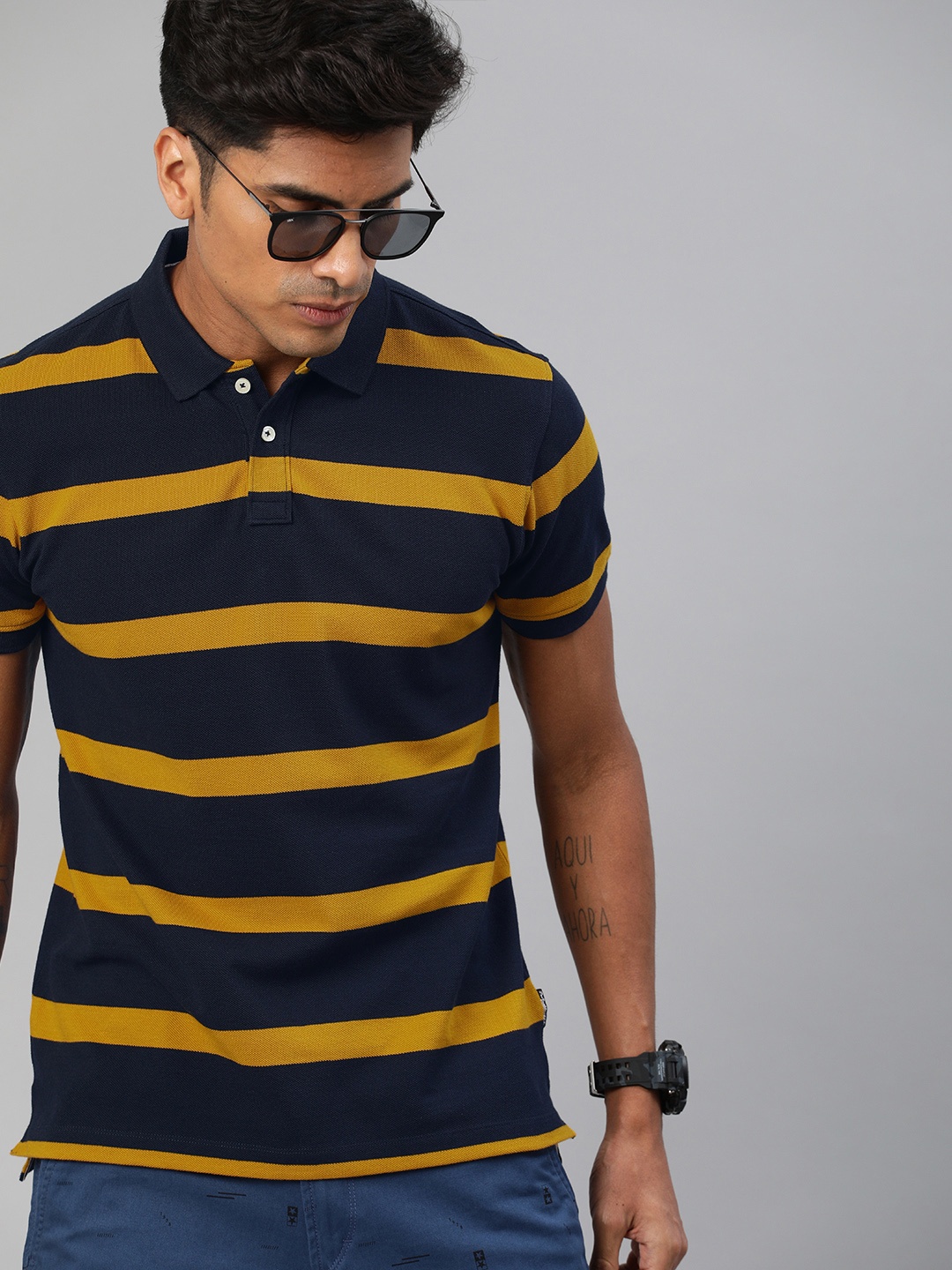 

The Roadster Lifestyle Co Men Navy Blue & Mustard Yellow Striped Polo Collar T-shirt