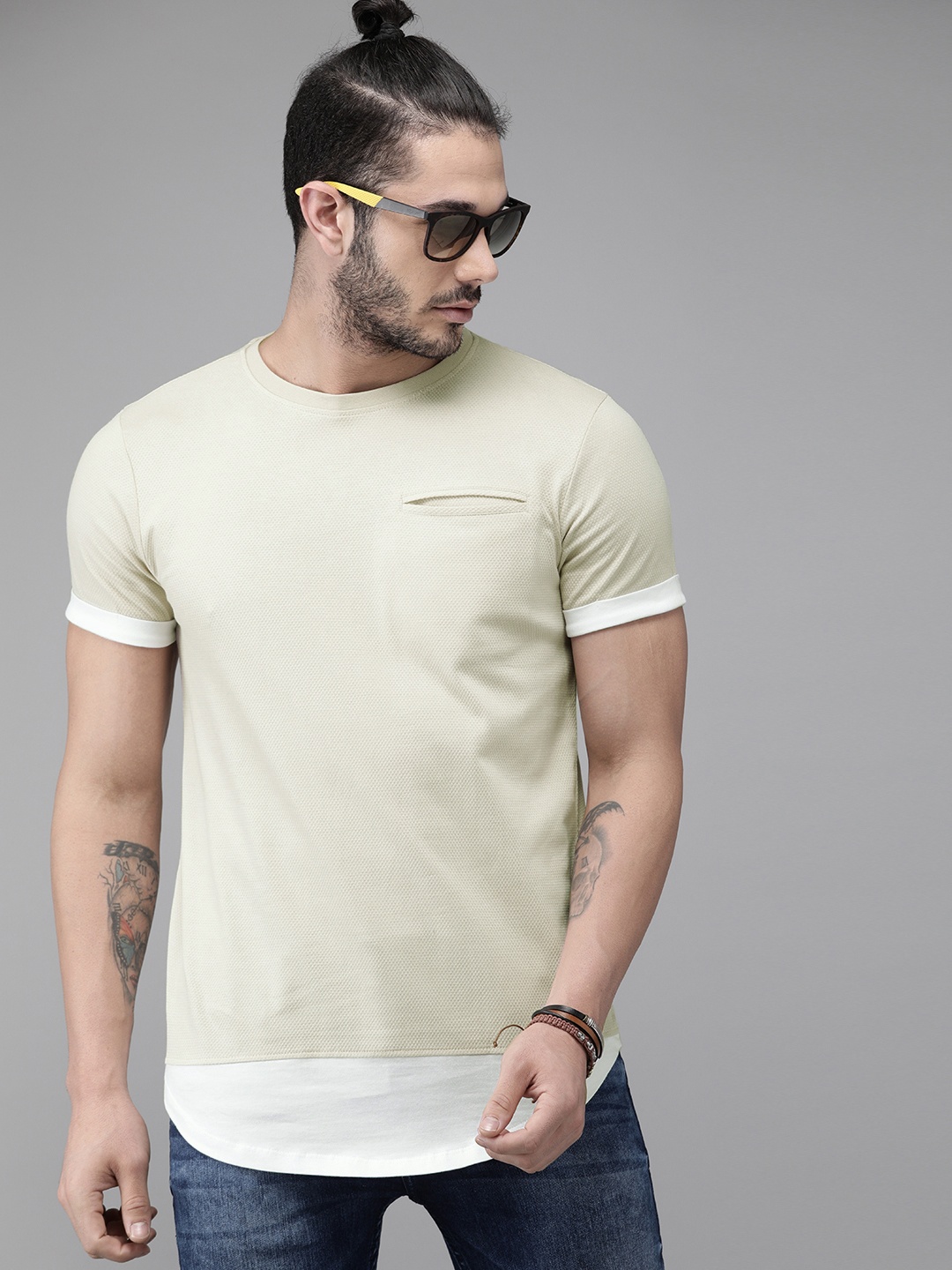 

Roadster Men Beige Self Design Round Neck Pure Cotton T-shirt With Contrast Hem