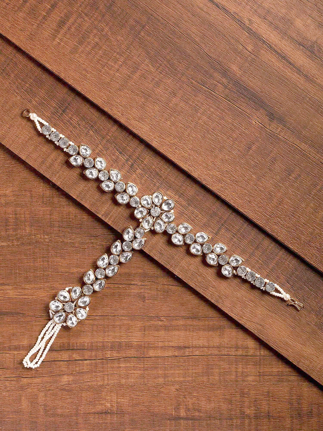 

Zaveri Pearls Gold-Toned & White Stone Studded Floral Shaped Ring Bracelet