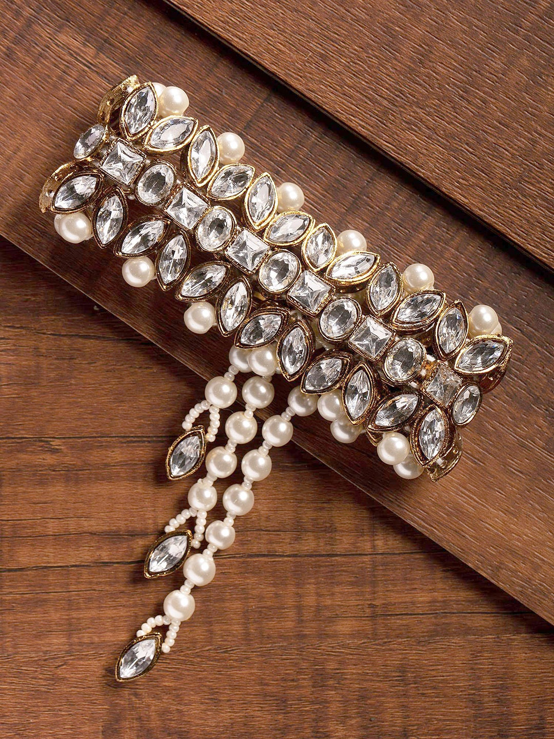 

Zaveri Pearls Gold-Toned & White Stone Studded Charm Bracelet