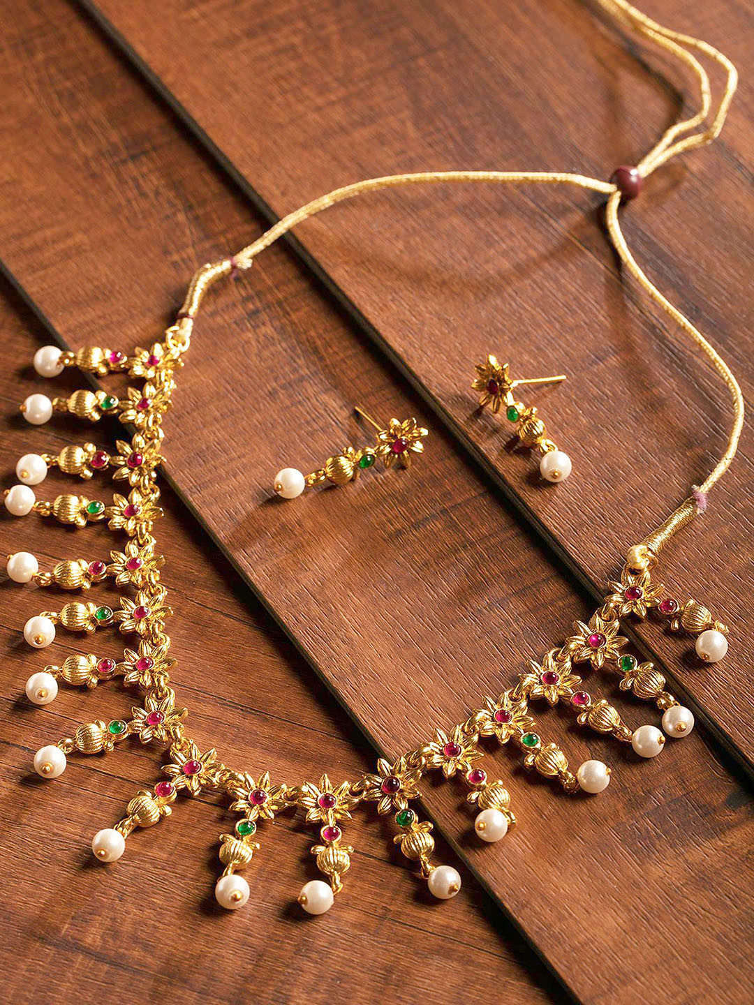 

Zaveri Pearls Gold-Plated & Red Jewellery Set