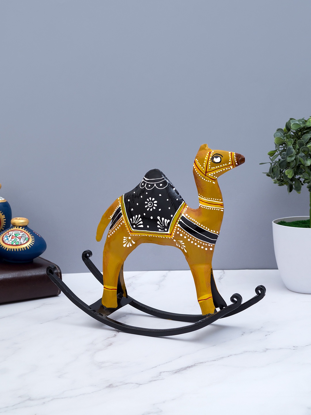

Golden Peacock Brown & Black Iron Handcrafted Statue Rocking Camel Showpieces