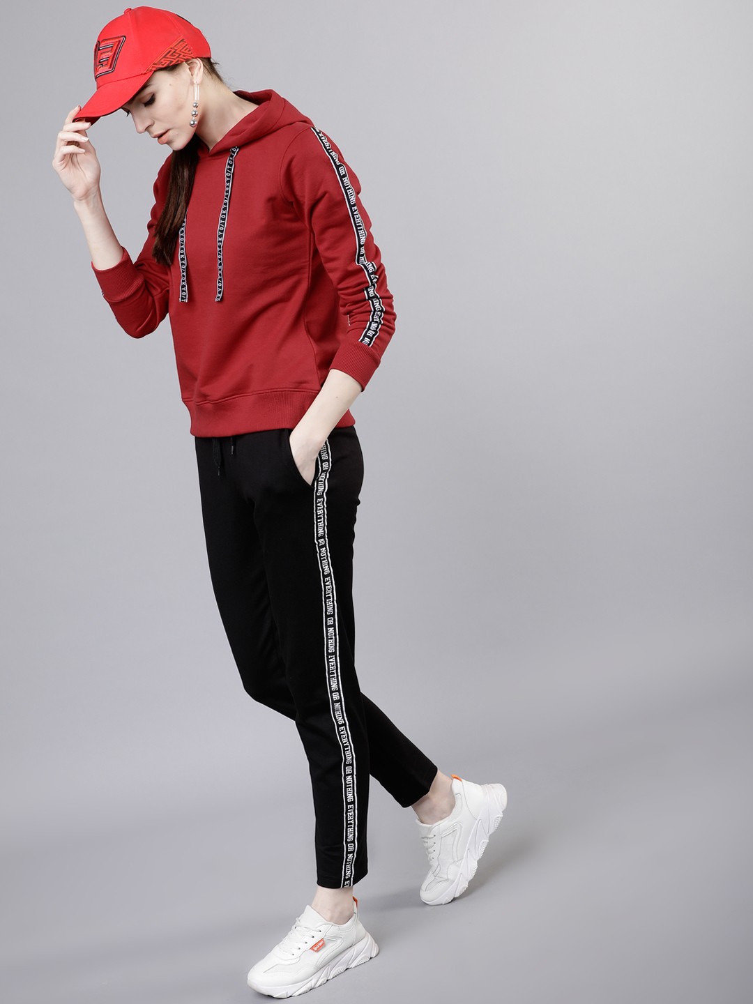 

Tokyo Talkies Women Red Solid Hooded Sweatshirt