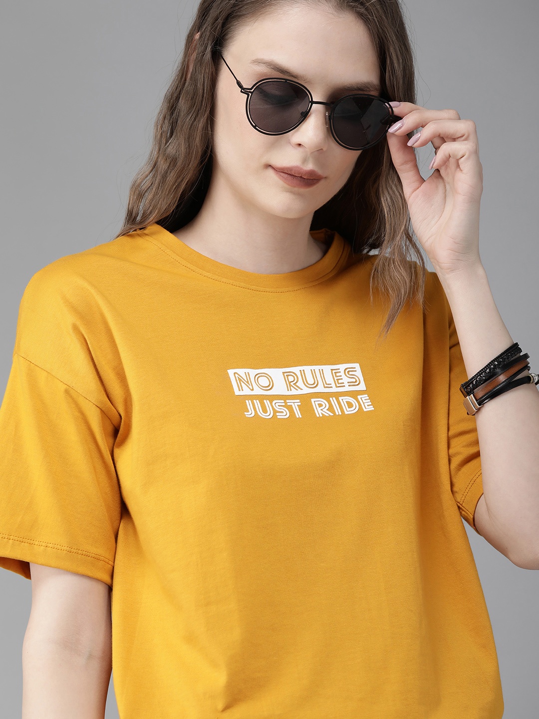 

The Roadster Lifestyle Co Women Mustard Yellow Solid Round Neck Pure Cotton T-shirt With Printed Detailing