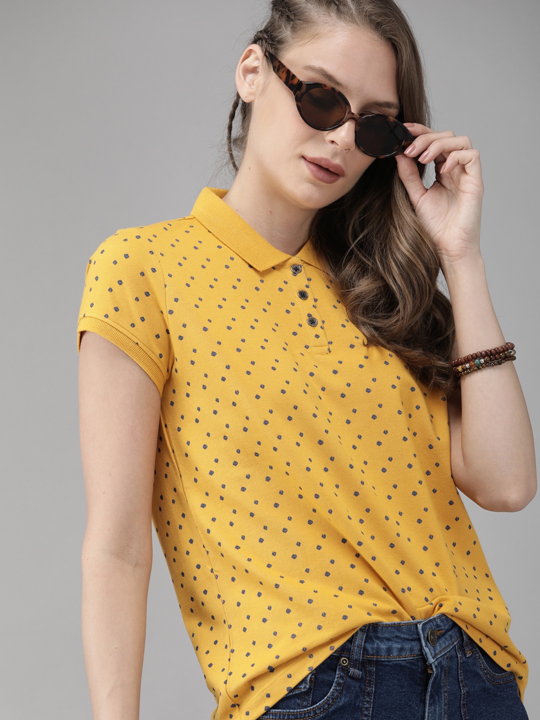 

The Roadster Lifestyle Co Women Yellow & Navy Blue Printed Polo Collar T-shirt