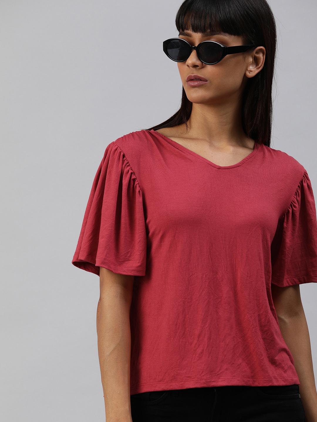 

The Roadster Lifestyle Co Women Maroon Solid Top with Flared Sleeves
