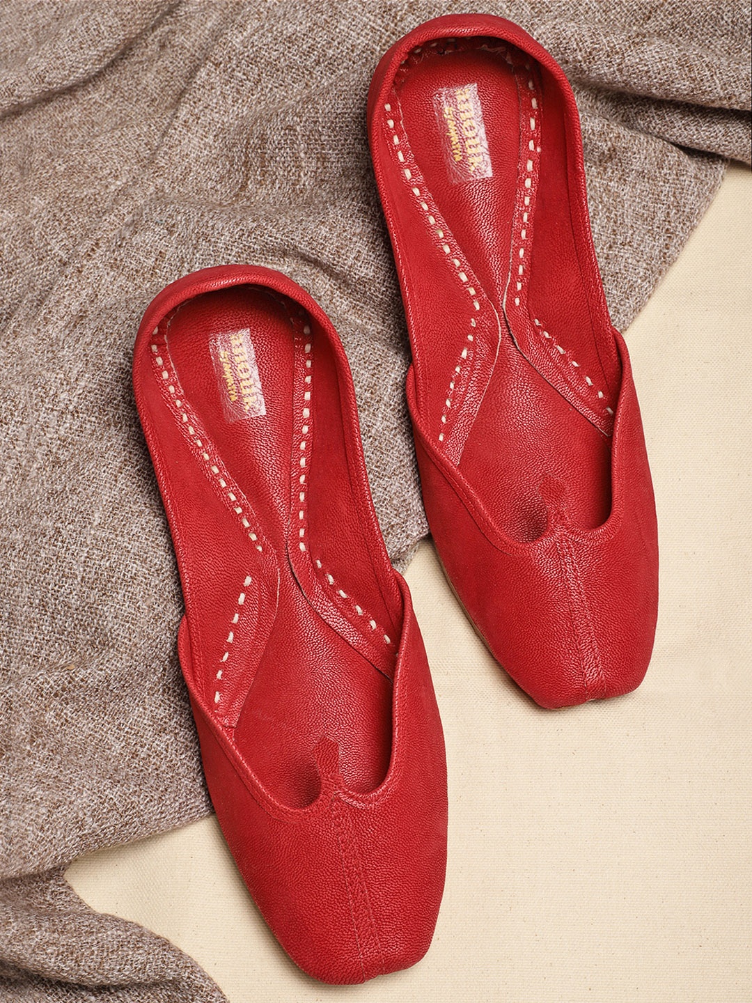 

Anouk Women Red Solid Mojaris