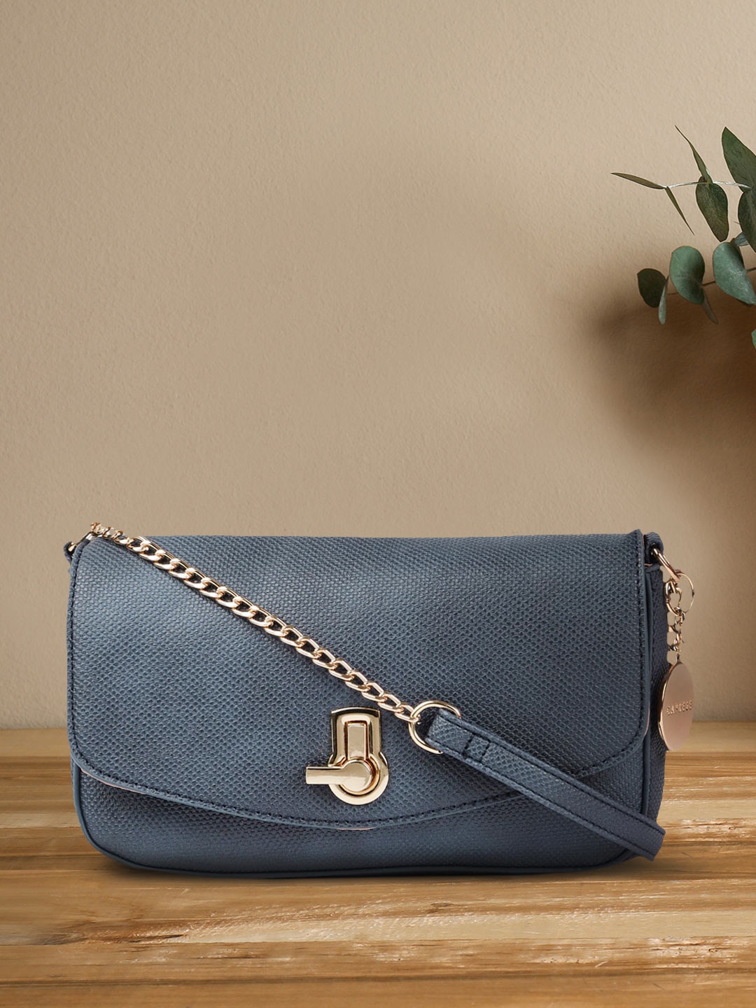 

Caprese Blue Textured Sling Bag