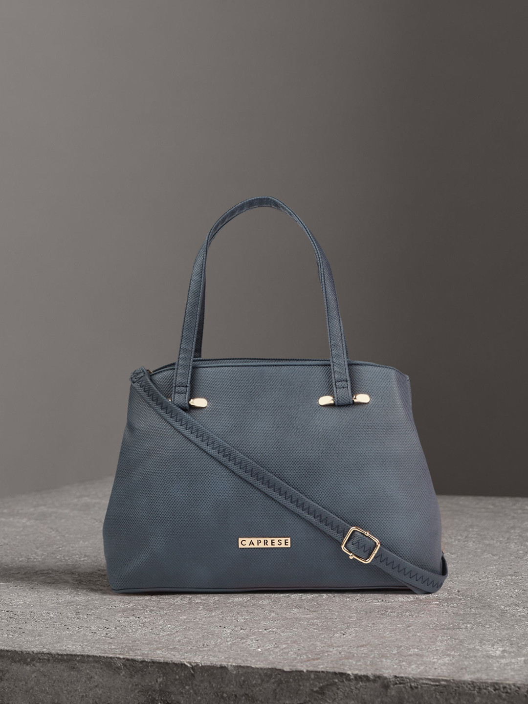 

Caprese Blue Textured Handheld Bag