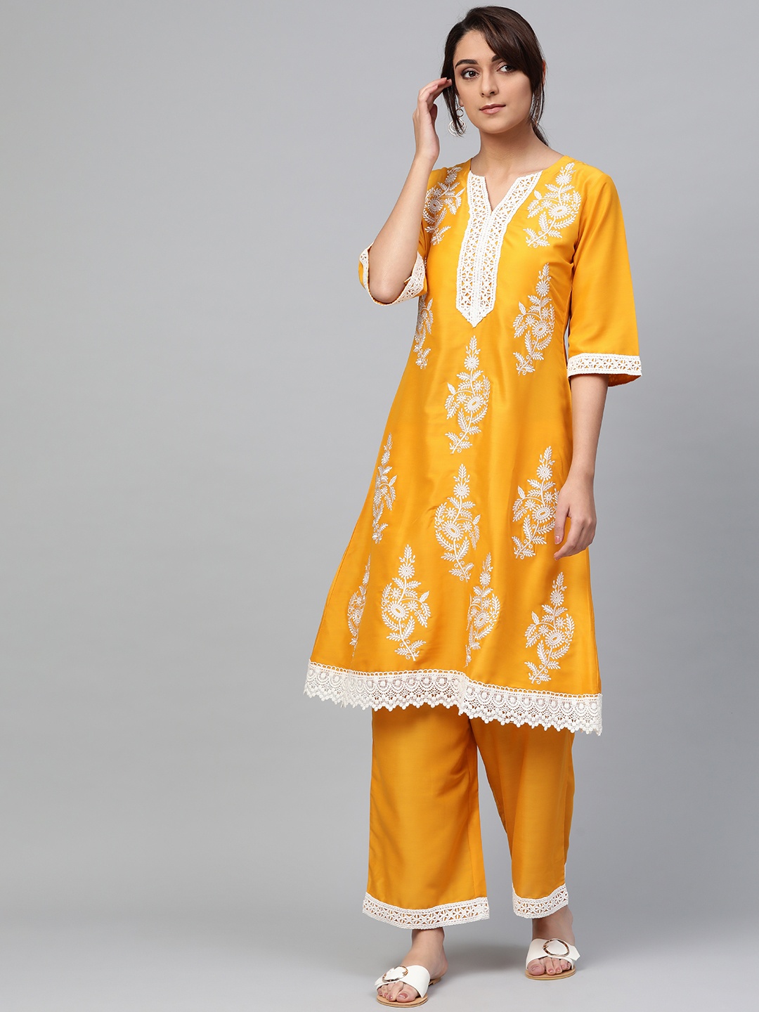 

Libas Women Mustard Yellow & White Embroidered Kurta with Palazzos