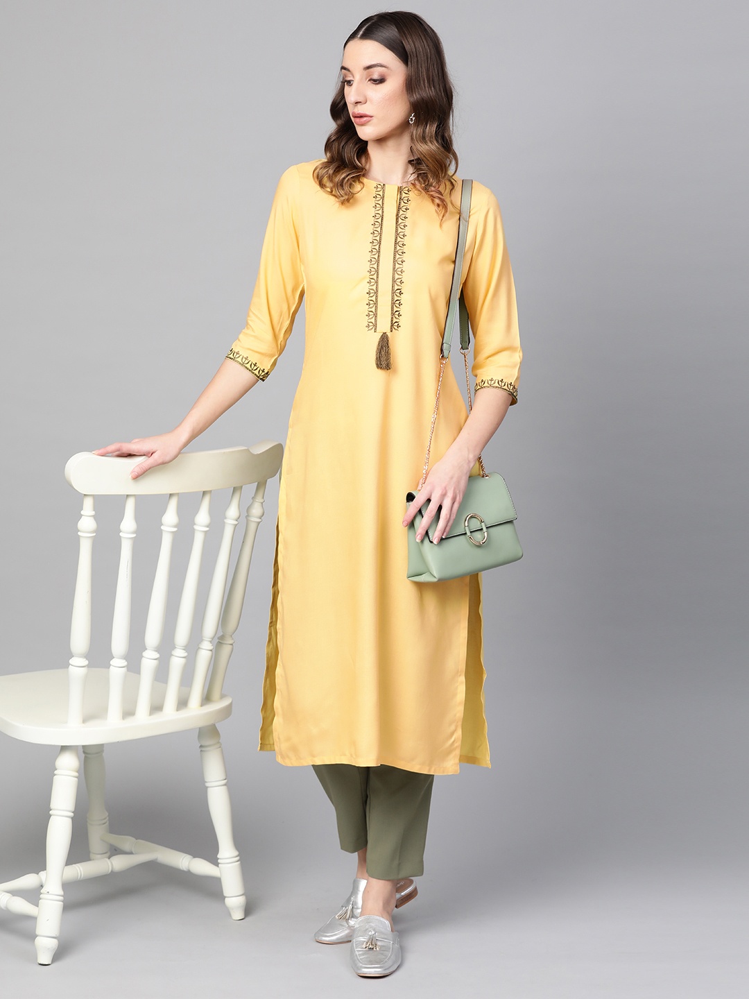 

Libas Women Yellow Yoke Design Straight Kurta