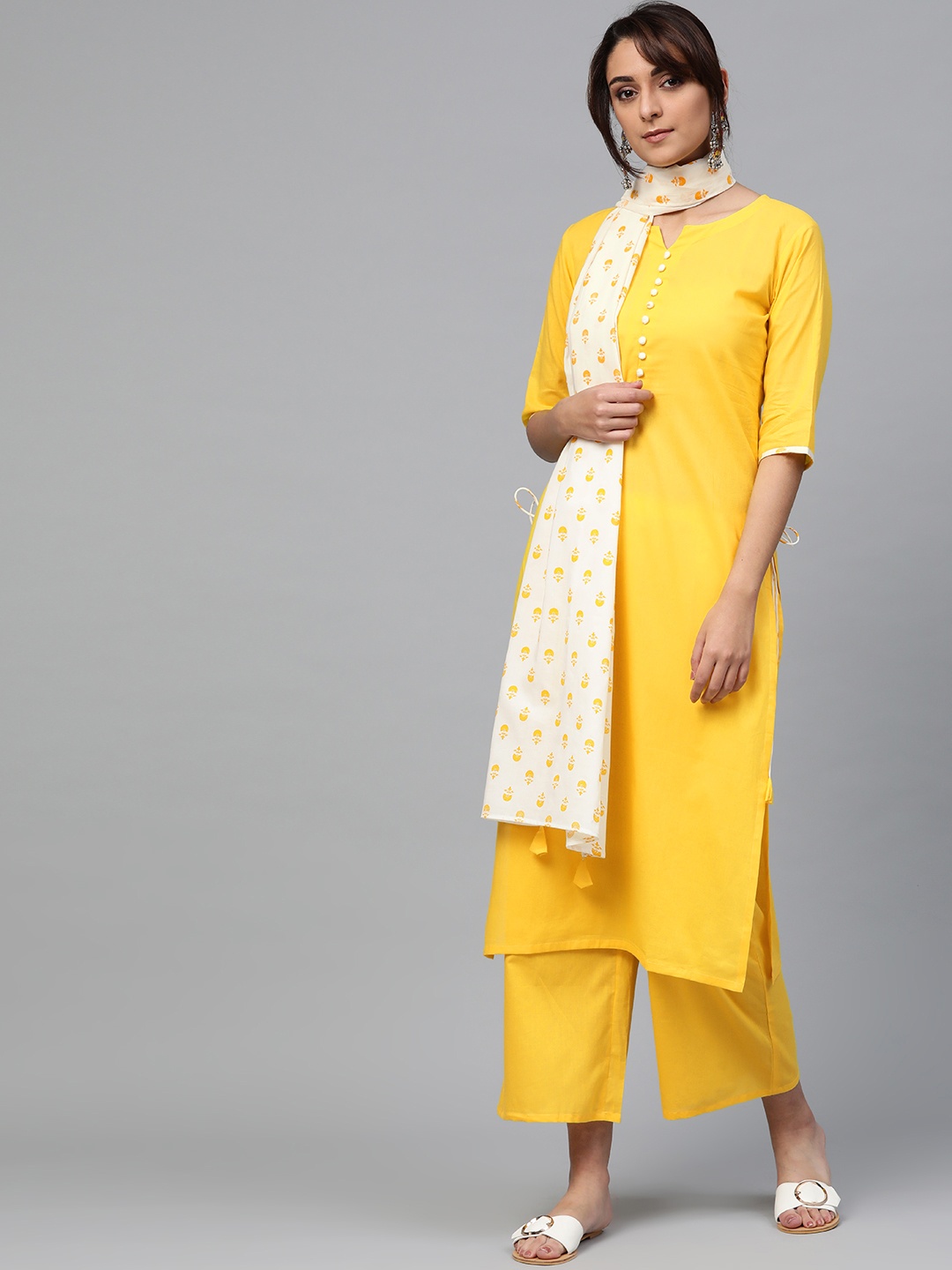 

Libas Women Yellow & Off-White Solid Kurta with Palazzos & Dupatta