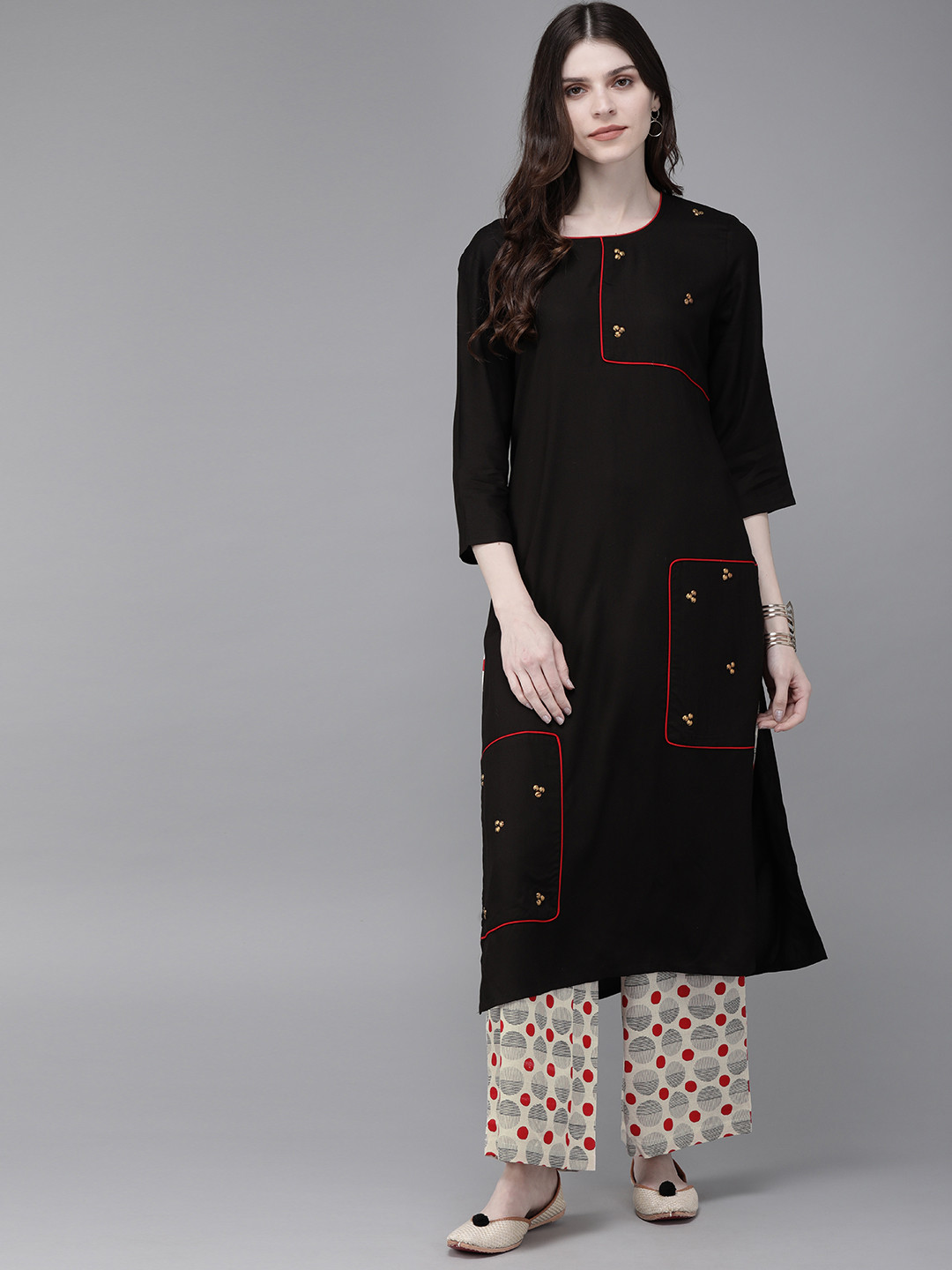 

Anouk Women Black & Beige Solid Kurta with Palazzos