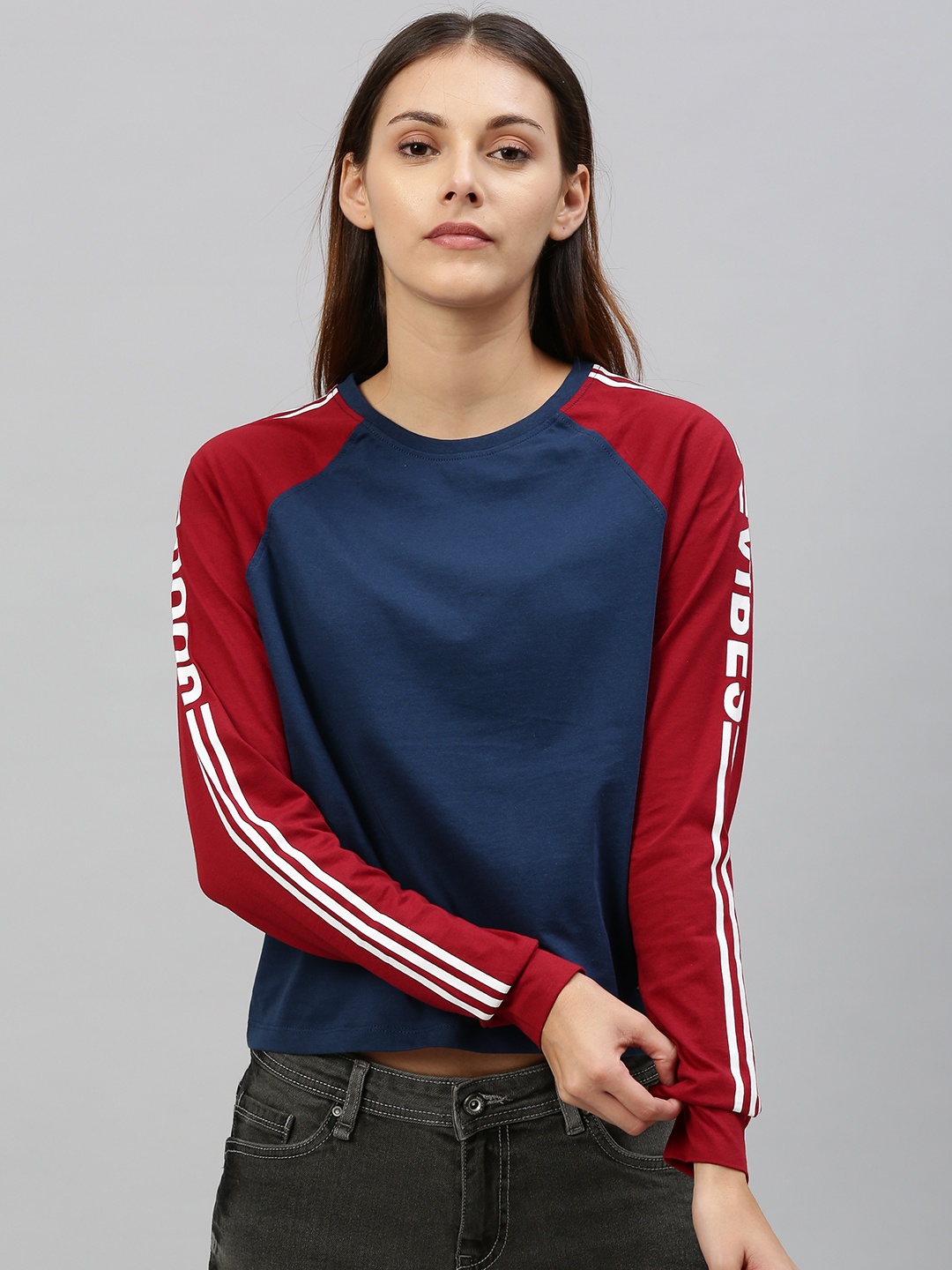 

The Roadster Lifestyle Co Women Navy Blue Solid Round Neck Top With Contrast Raglan Sleeves