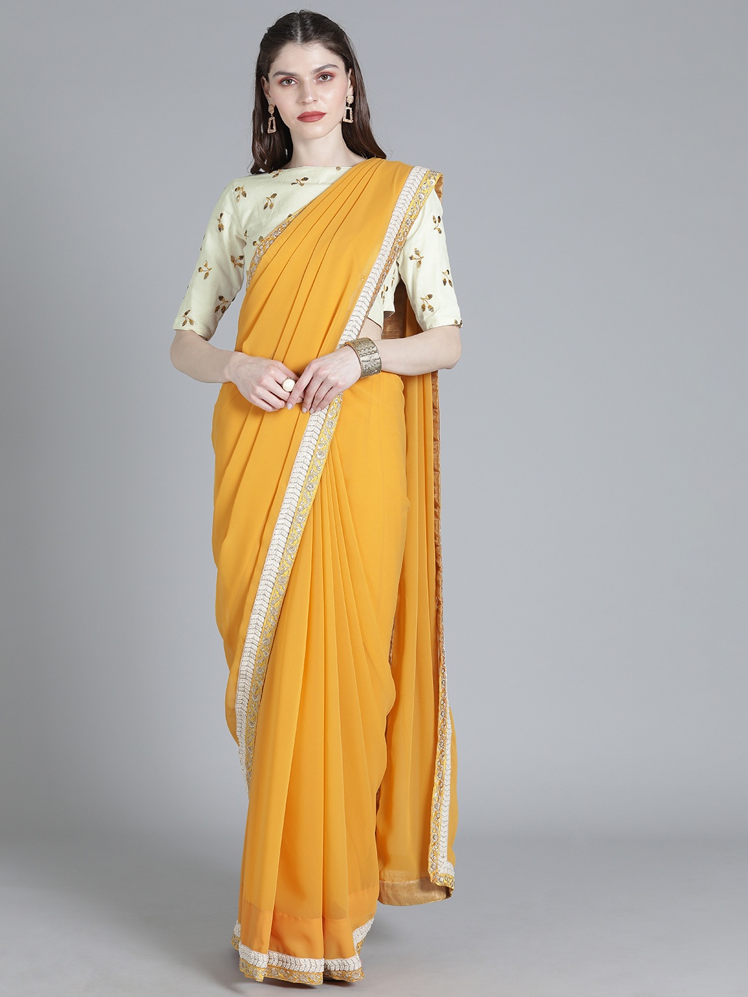 

Ethnovog Mustard Yellow Off-White Poly Georgette Solid Made To Measure Saree