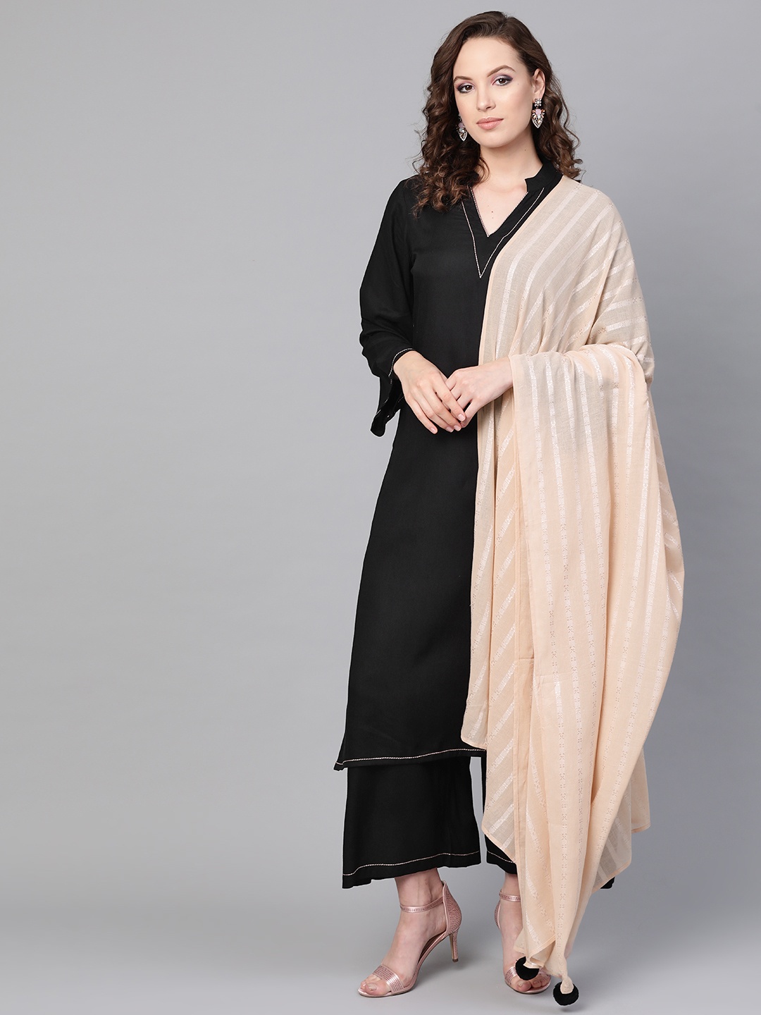 

Idalia Women Black Solid Kurta with Palazzos & Dupatta