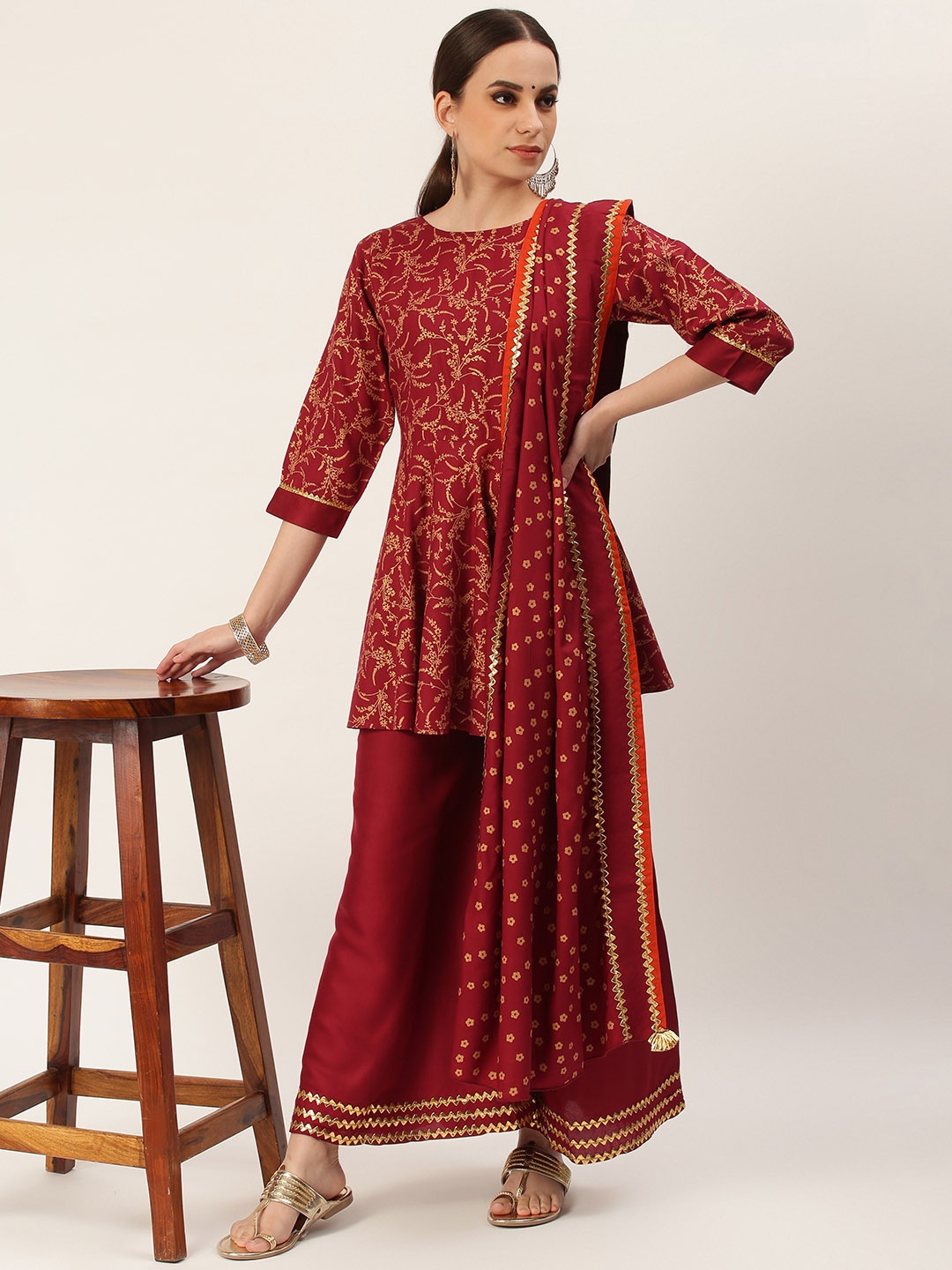 

Rustorange Women Maroon & Gold-Toned Printed Kurti with Sharara & Dupatta