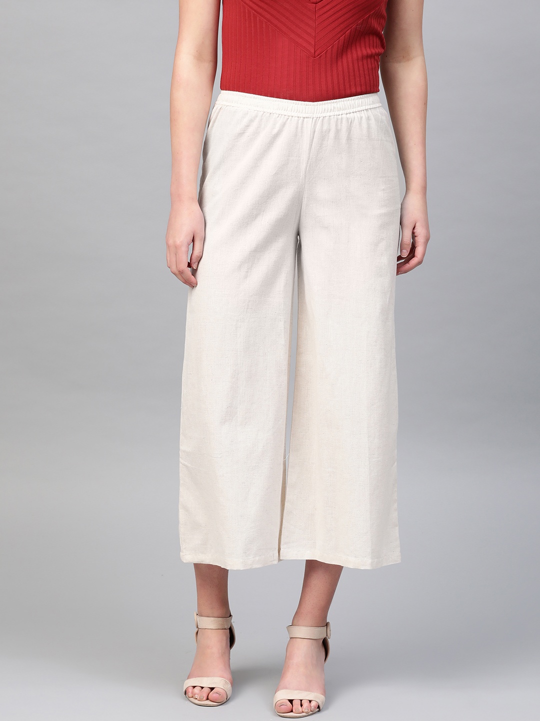 

PINKSKY Women Beige Solid Straight Cropped Palazzos