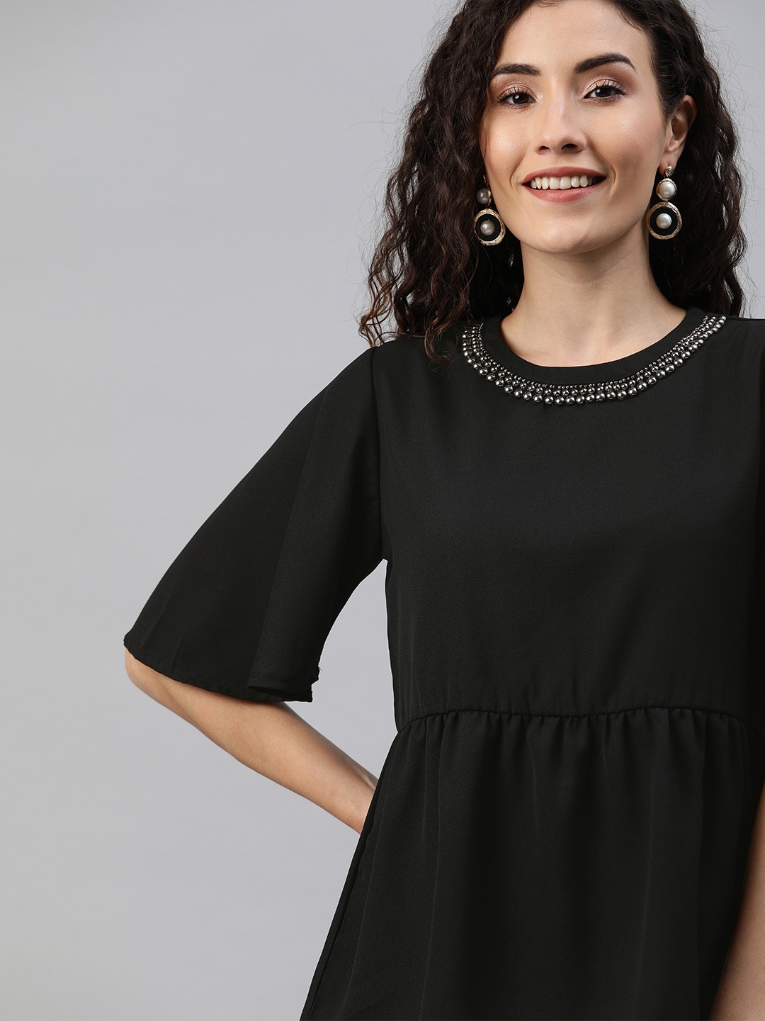 

Chemistry Women Black Solid A-Line Top with Embellishments