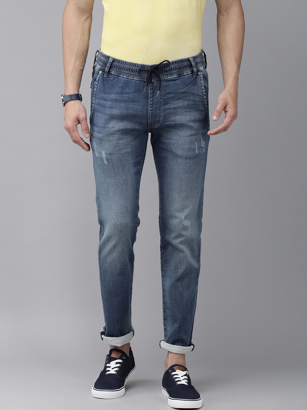 

Pepe Jeans Men Blue Vapour-E Tapered Fit Low-Rise Mildly Distressed Stretchable Jeans