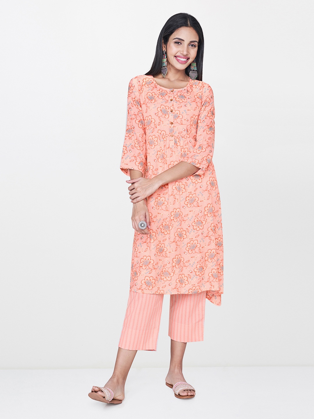 

Global Desi Women Peach-Coloured & Blue Printed Asymmetric Hemline A-Line Kurta