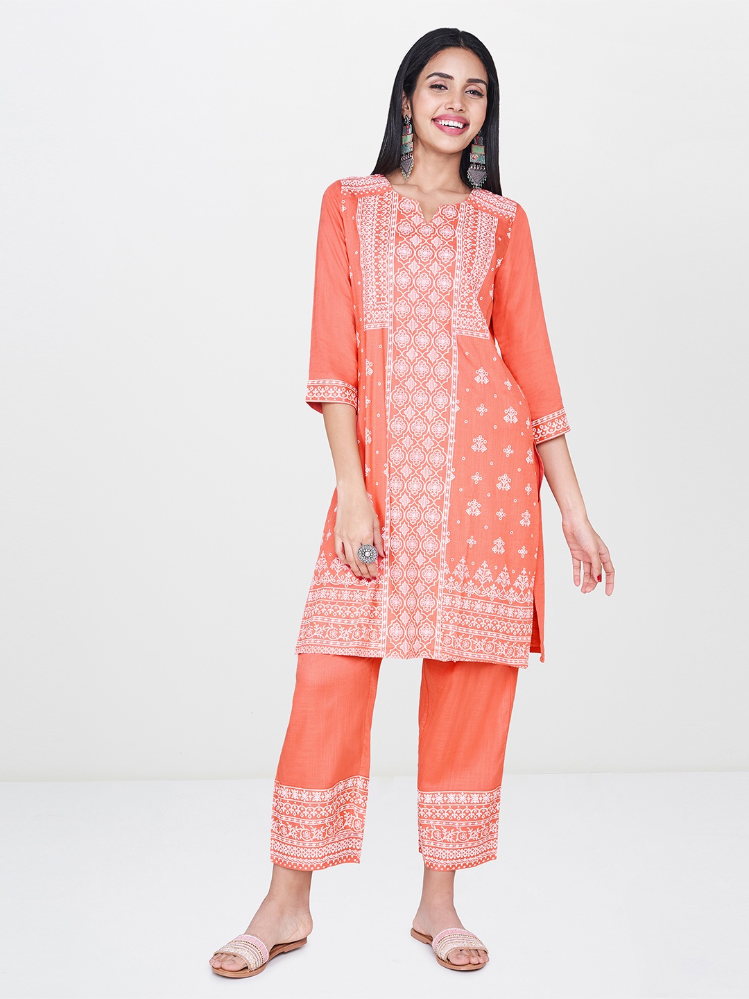

Global Desi Women Coral Pink & White Printed Kurta with Trousers