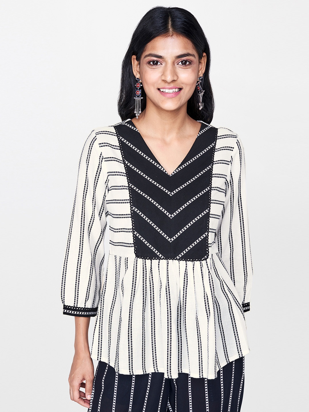 

Global Desi Women Off-White & Black Printed A-Line Pure Cotton Top