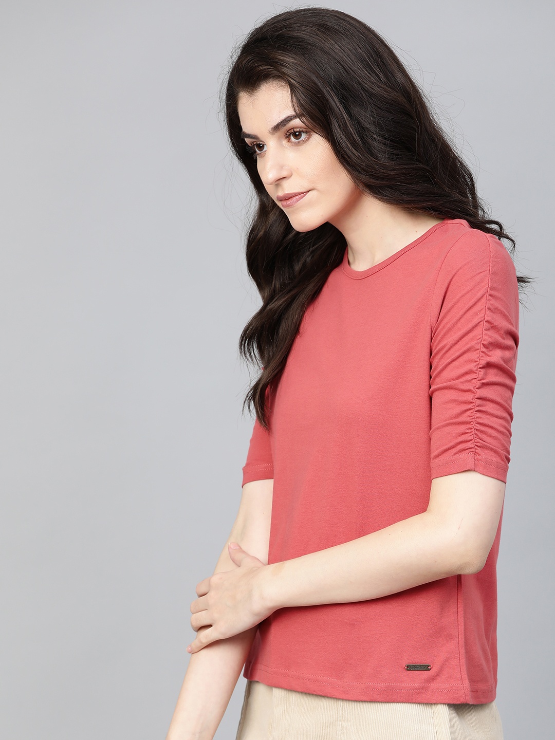 

Roadster Women Coral Pink Solid Round Neck Relaxed FitT-shirt