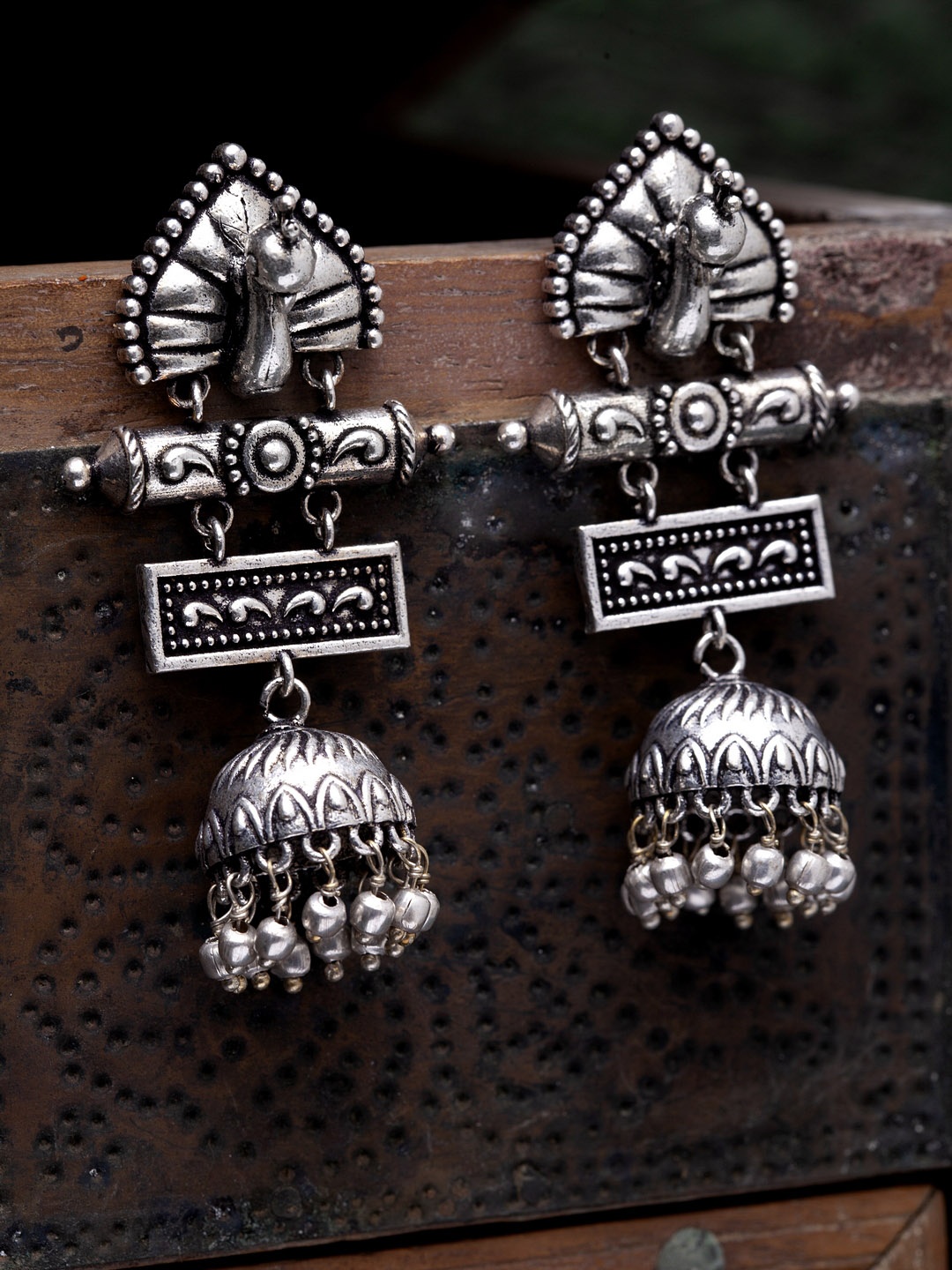 

Infuzze Silver-Toned Dome Shaped Brass-Plated Jhumkas