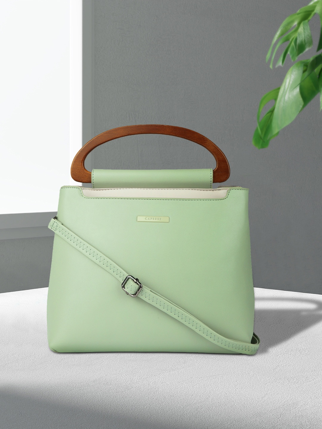 

Caprese Green Solid Handheld Bag