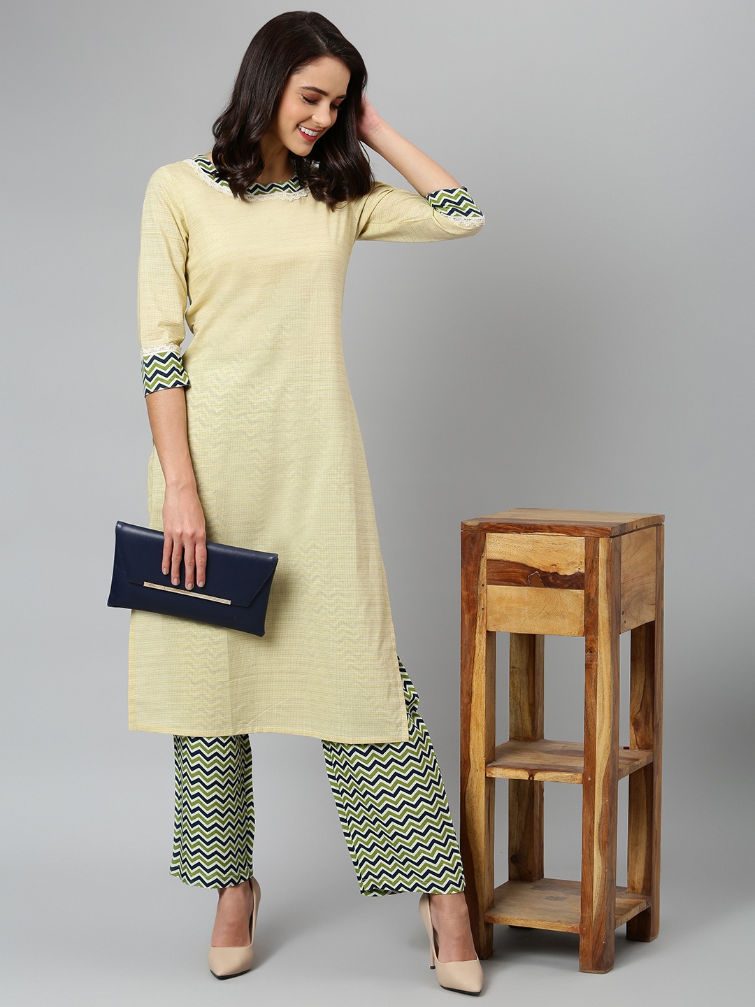 

Khushal K Women Beige Printed Kurti with Palazzos