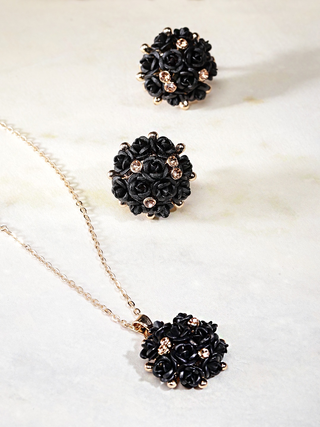 

YouBella Black Gold-Plated Stone-Studded Floral Shaped Jewellery Set