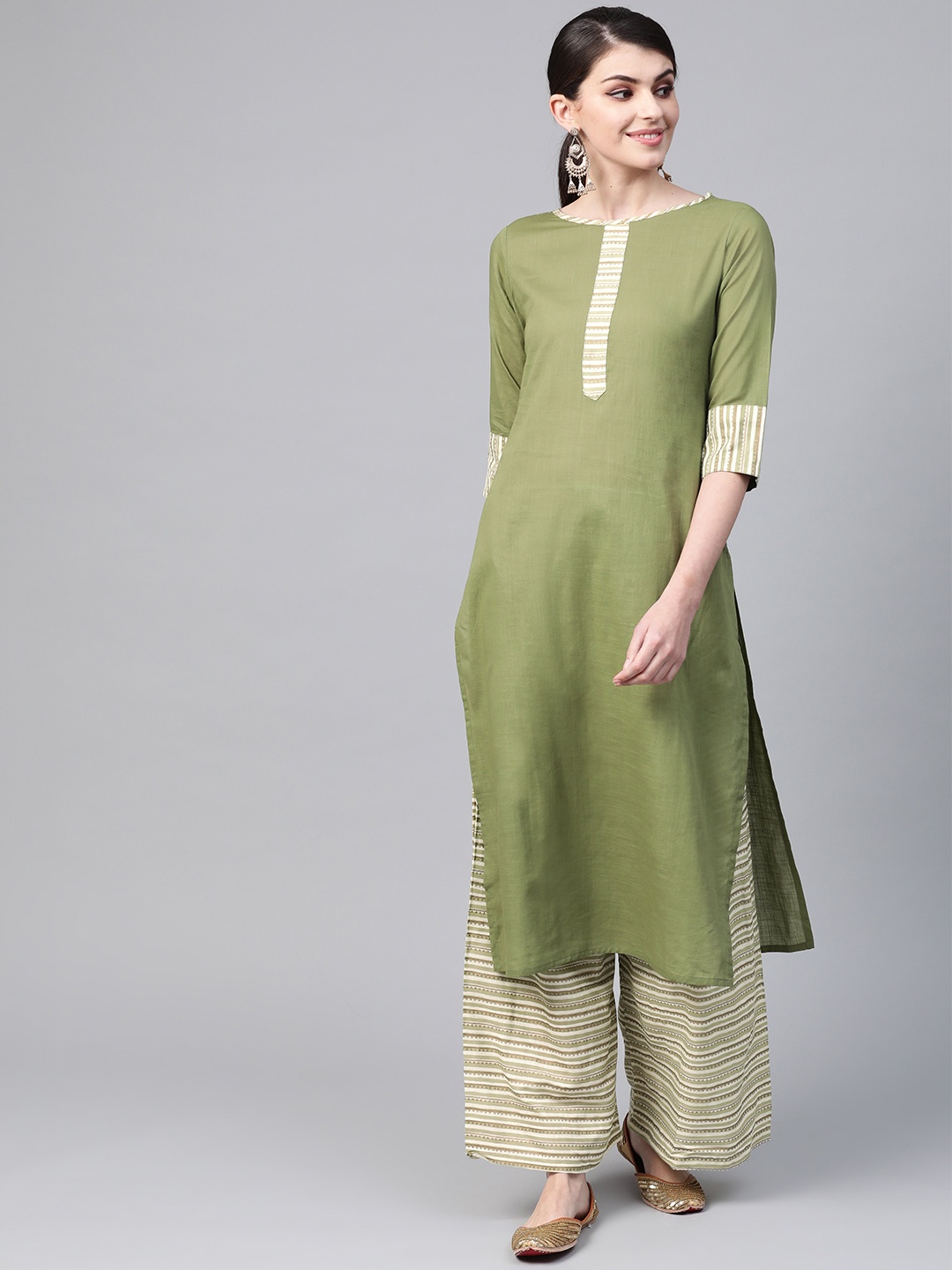 

Meeranshi Women Green & Off-White Solid Kurta with Palazzos
