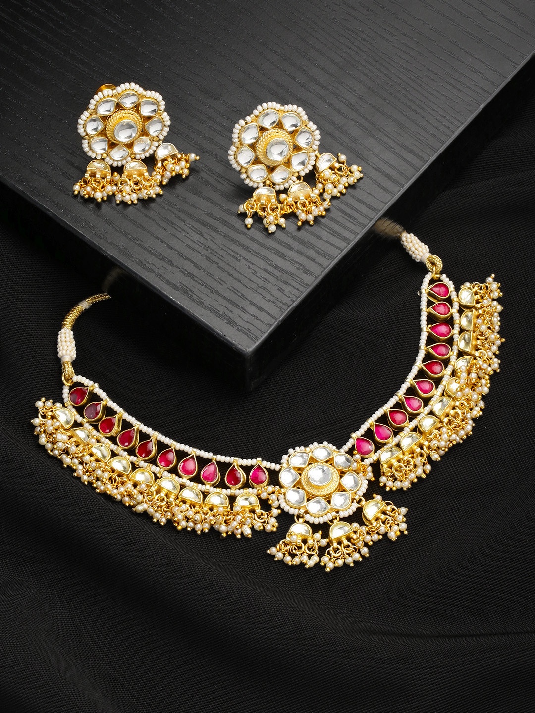 

Justpeachy Gold-Toned & Red Kundan Stone Studded Jewellery Set