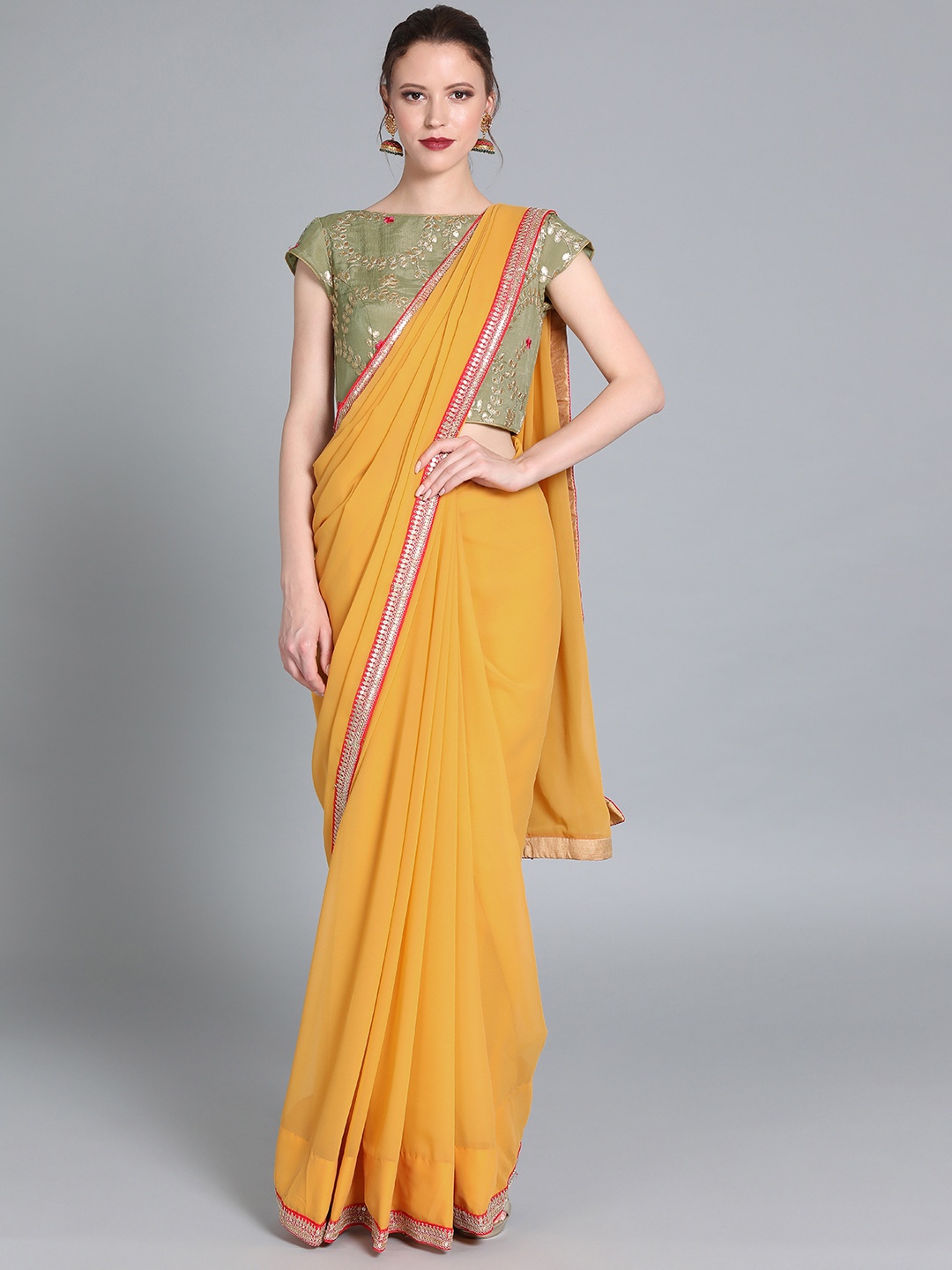 

Ethnovog Mustard Yellow Solid Poly Georgette Saree